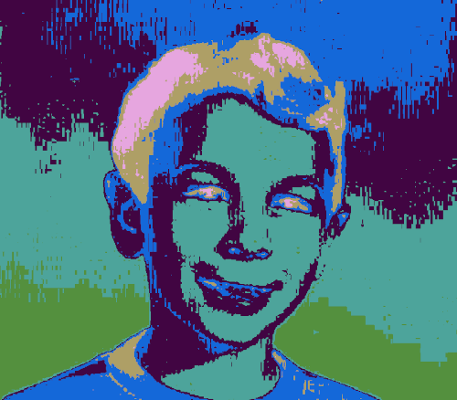 A color-glitched photo of a smiling boy. The main colors are blue and green. The boy has brown and pink highlights in his wavy hair, and his eyes glow pink. His lips are blue.